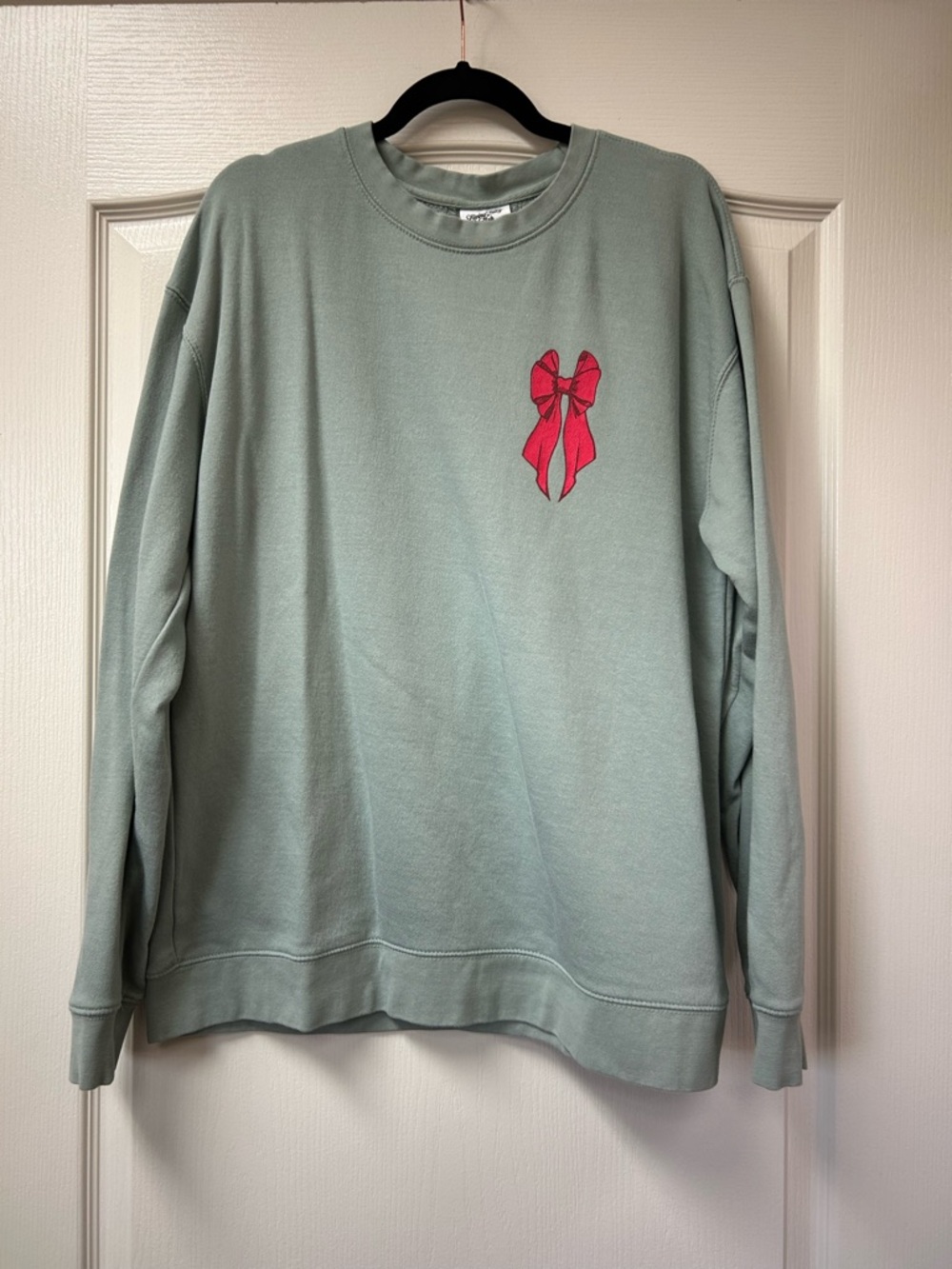 Living Fully Co-Muted Sage Green Crewneck Sweatshirt with Red Bow Accent